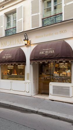 Angelina Paris - Rivoli pastry shop and tea room with brown awnings and display windows on a Paris street.